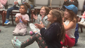 young kids clapping and smiling